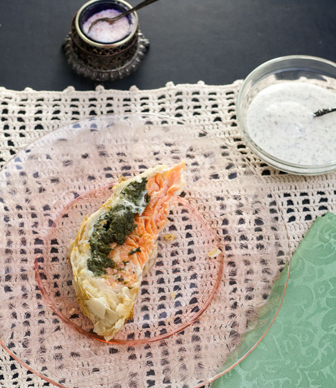 slice of Salmon wellington on pink plate