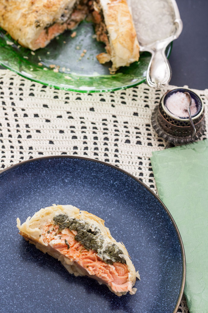 slice of salmon en croute on blue plate