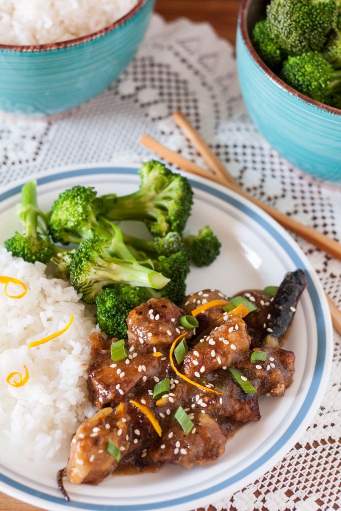 Sesame Orange Chicken stir fry with orange garnish