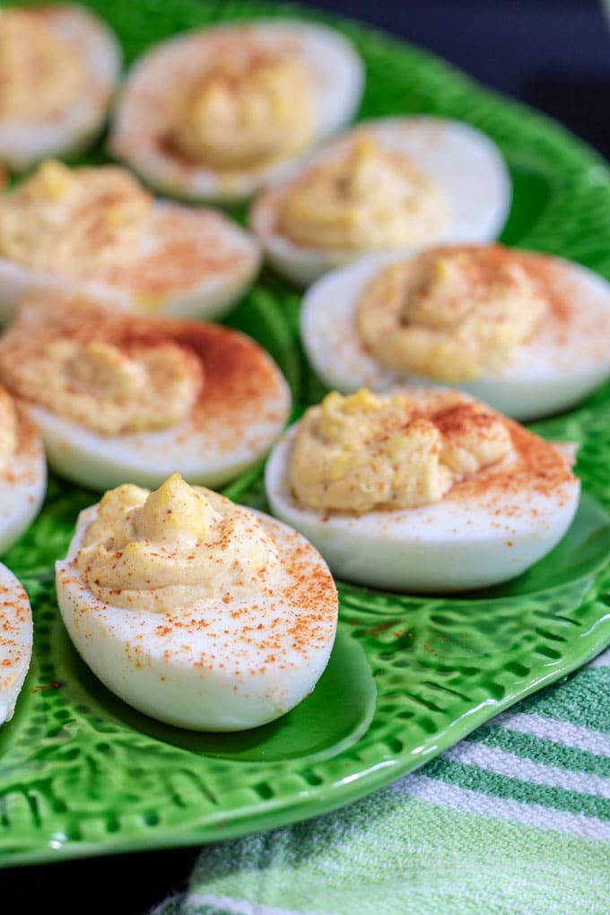 smoky deviled eggs on green platter for july 4th recipe
