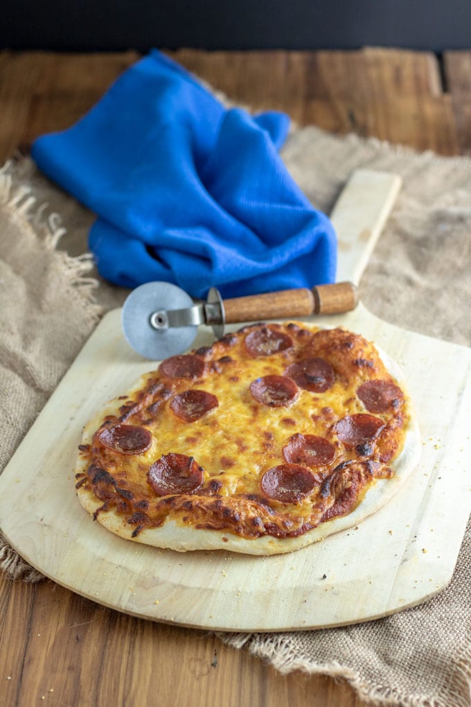 pepperoni pizza on barnwood background