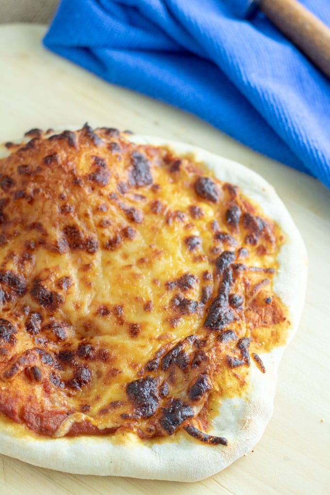 close up browned cheese pizza