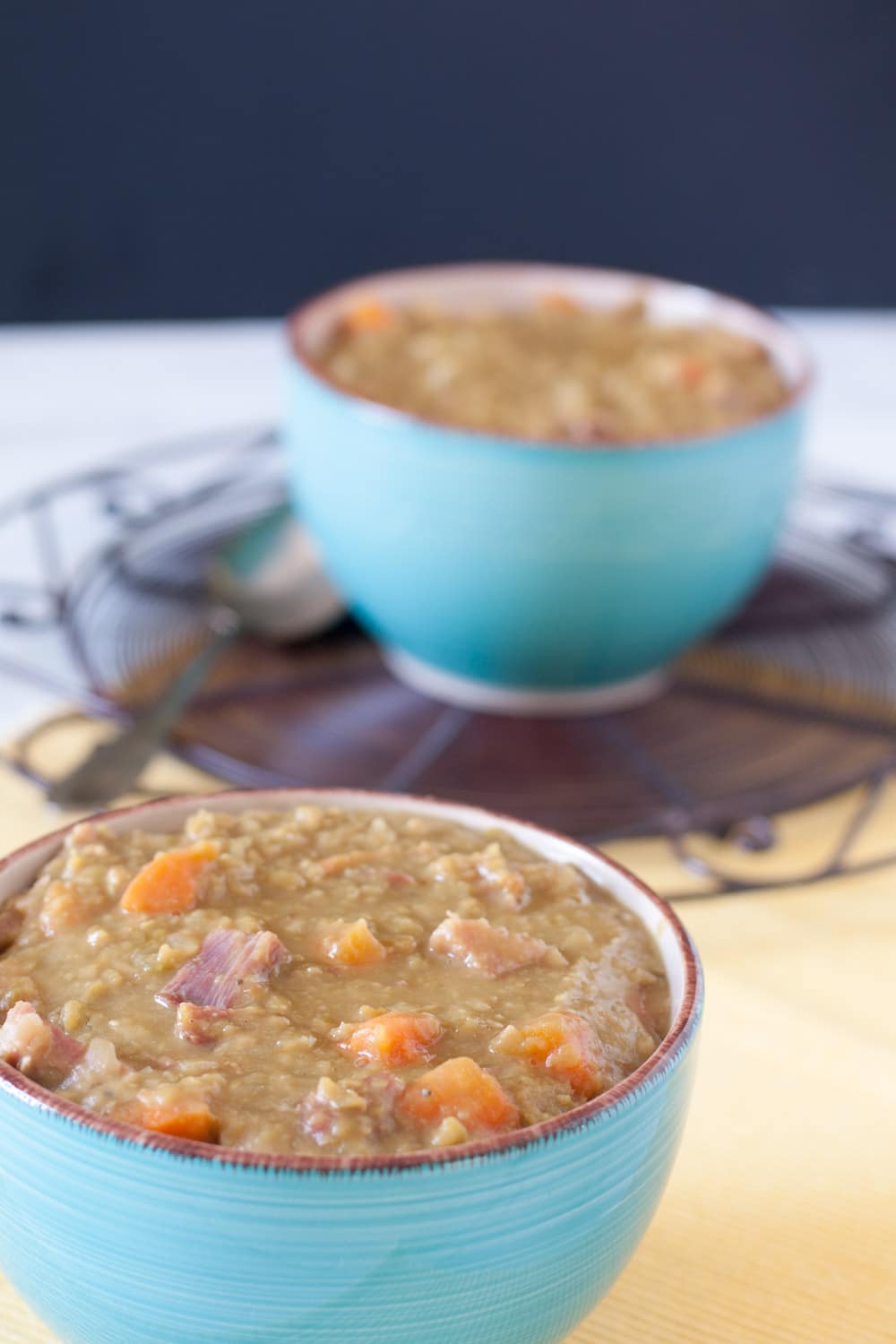 Close up of split pea soup in blue bowl