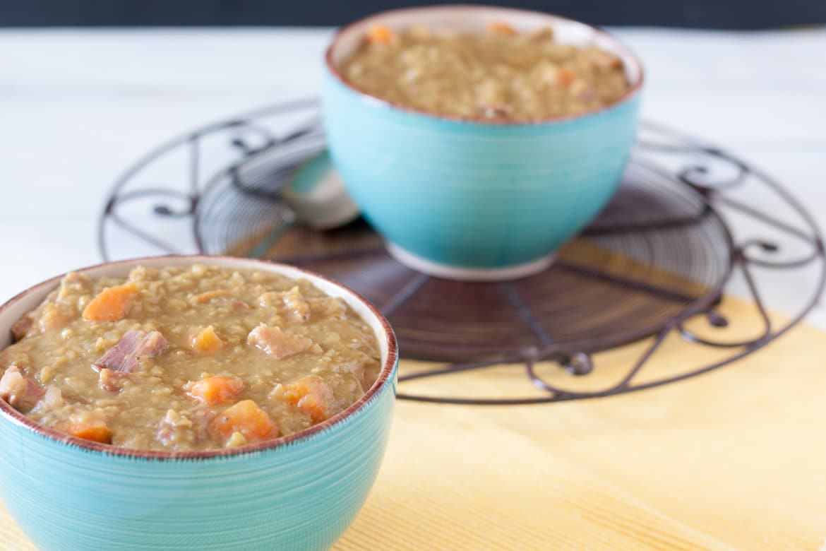 2 bowls split pea soup on antique metal stand