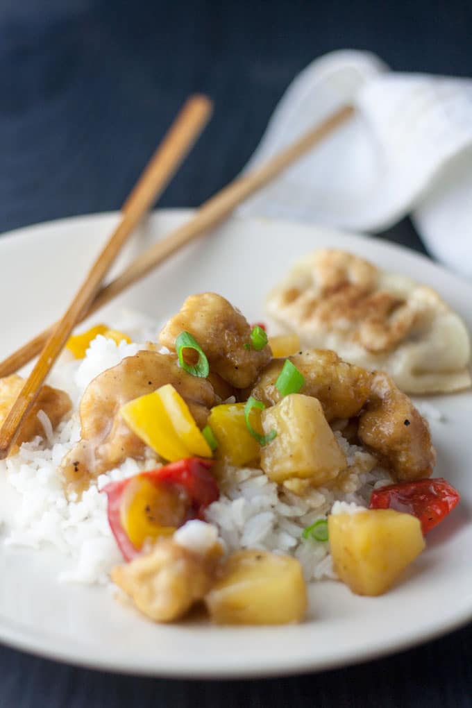 colorful sweet and sour chicken with rice and chopsticks colorful sweet and sour chicken with rice and chopsticks