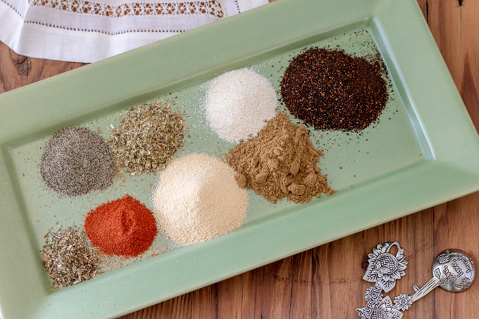 piles of spices on green plate