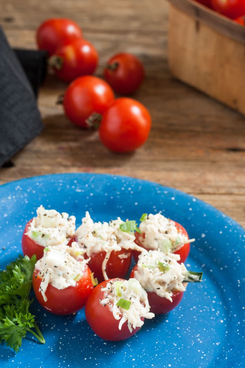 5 Chicken Stuffed Tomato Bites on blue pewter plate.