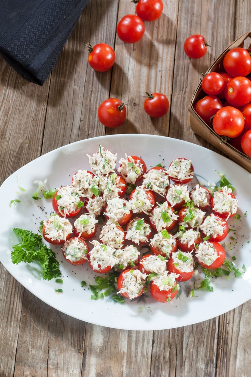 Chicken Stuffed Tomato Bites  overhead photo with basket of cherry tomatoes.