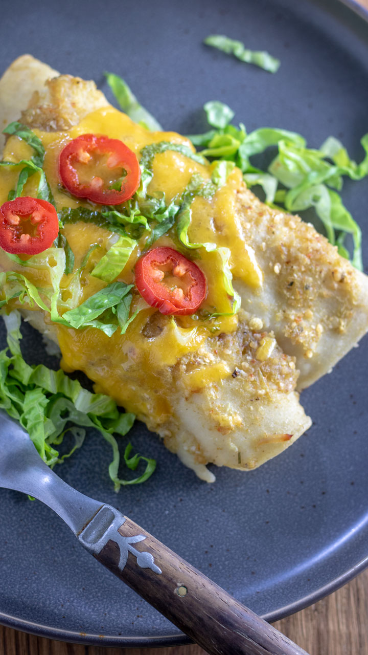 close up of chicken enchiladas verdes.