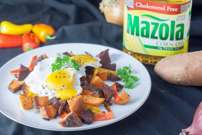 Corned Venison with sweet potato hash topped with sunny side up egg.