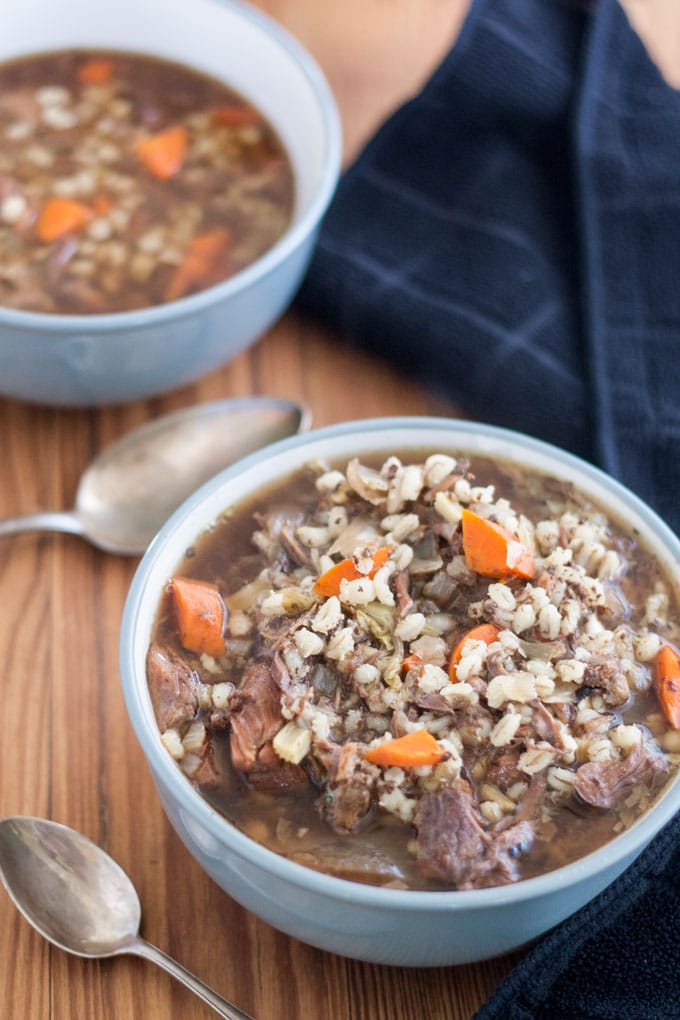 venison soup on barn wood board