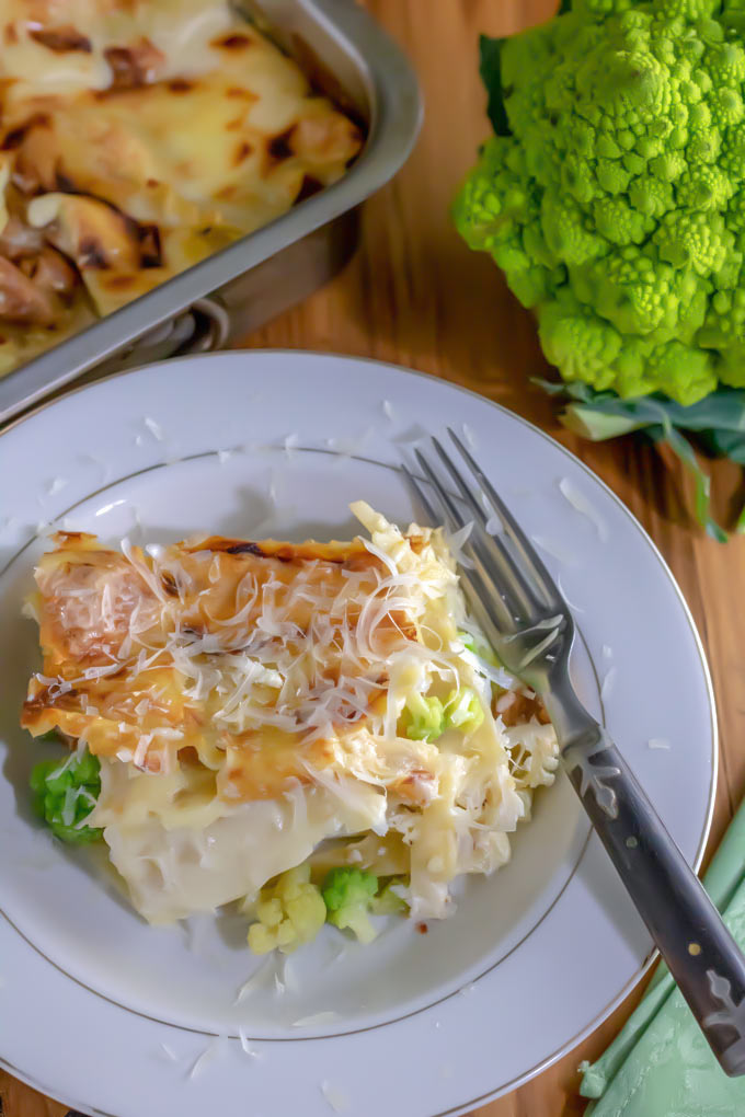 piece of white lasagna in white bowl with Romanesco
