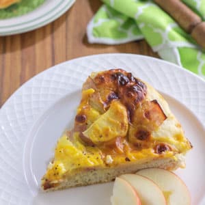 breakfast pizza slice on white plate