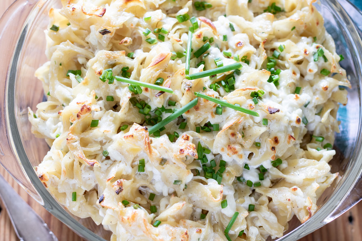 Casserole Marie Blanche in a glass casserole dish garnished with chives.