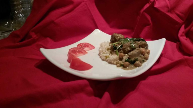 Lamb Meatballs with Coconut Curry on a plate.