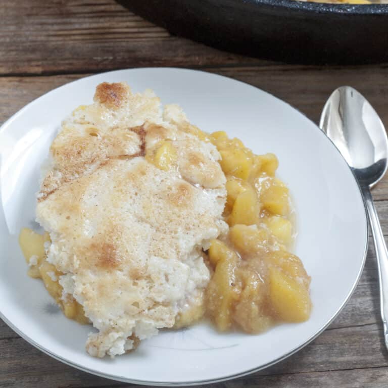 peach cobbler on white plate