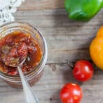 Jar Oscar Relish, which is red and green with a spoon scooping some out