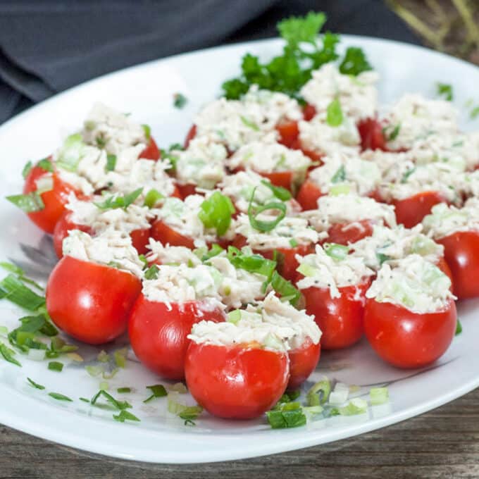 Bright cherry tomatoes on white plate.