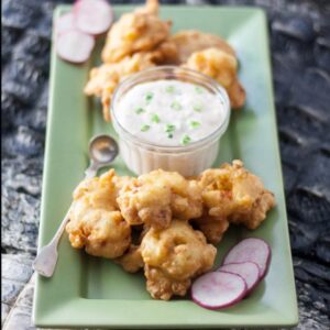 alligator hush puppies on green plate