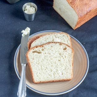 brioche on tan plate with blue rim
