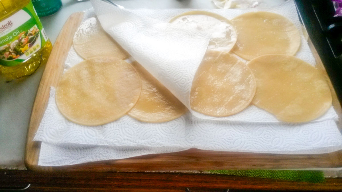 Tortillas on paper towels to absorb some of the oil.