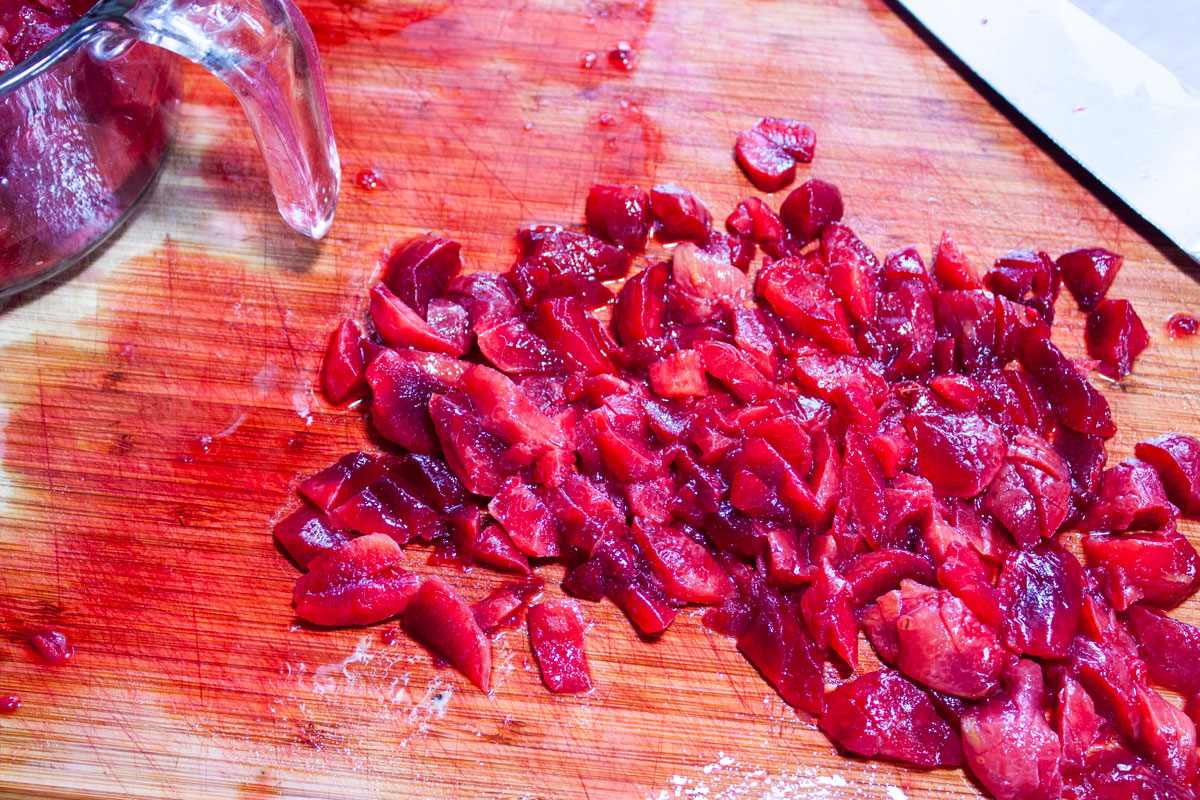 Chopped plums on the cutting board.