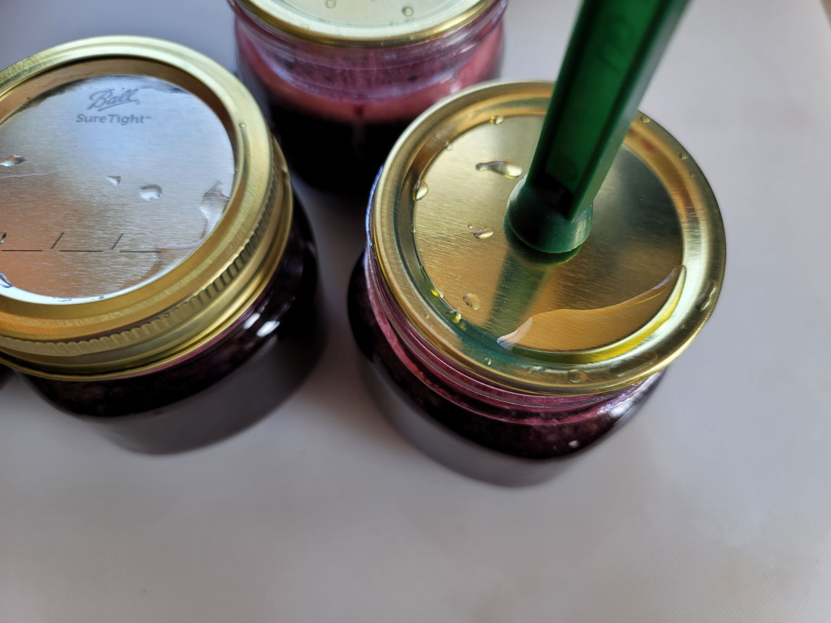 Centering the lid on the jar.