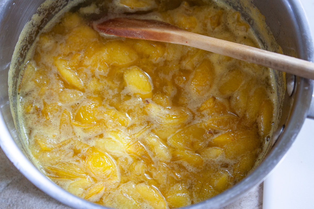Plums in pot after cooking.
