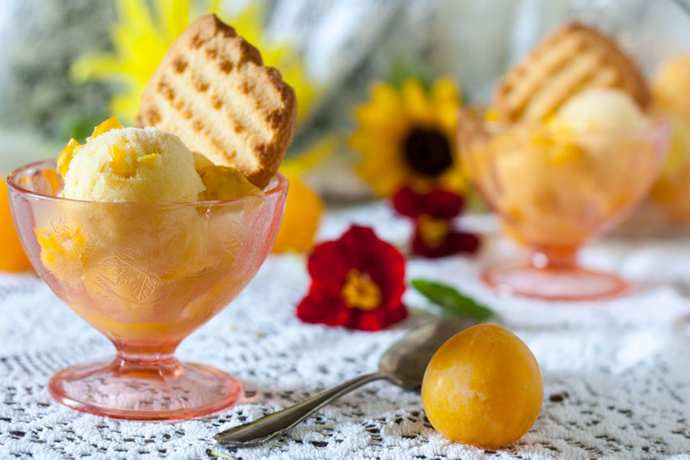 Sorbet in pink, footed dessert bowls.