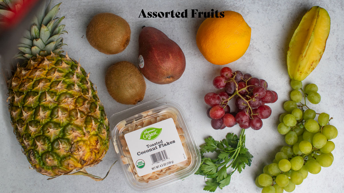 Various fruit on a white board.