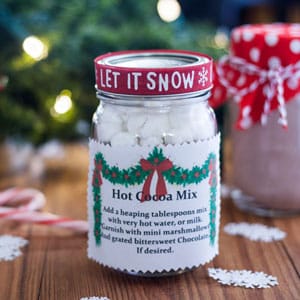 Hot cocoa in a pint jar with instructions, and decorations to gift to family and friends