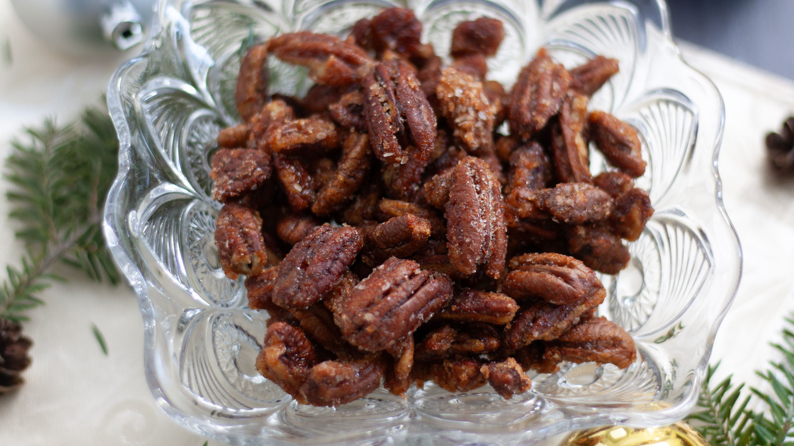 Spicy nuts in a glass bowl.