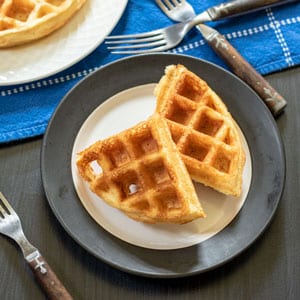 belgian waffles on white and black plate