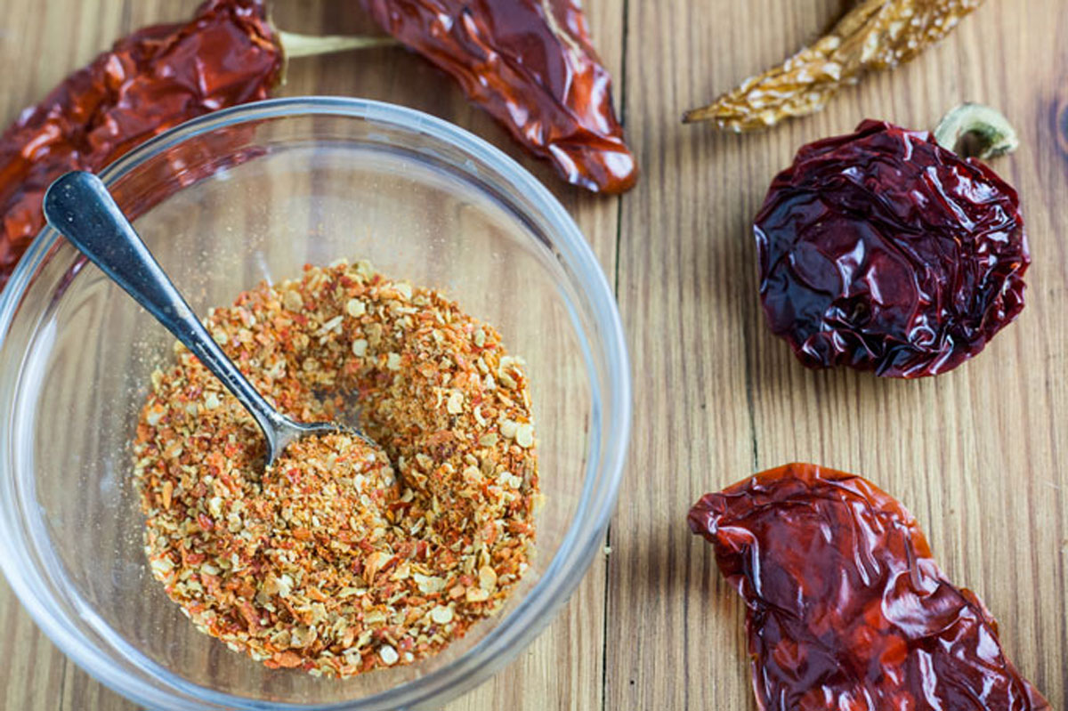 Habanero crushed peppers in small bowl, with silver spoon