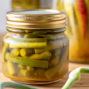 pickled garlic scapes in canning jars