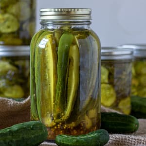 spears of sweet pickles in quart canning jar