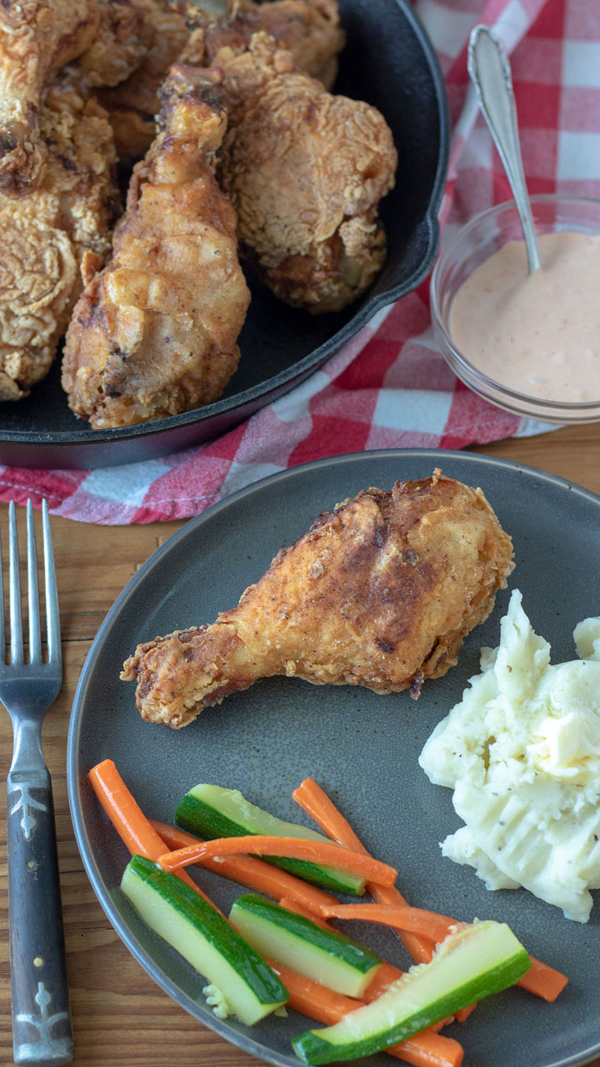 Plate of chicken, mashed potatoes and vegetables.