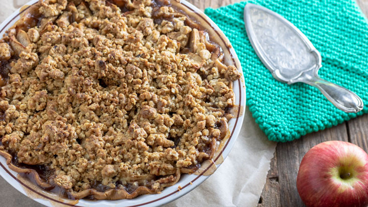 Whole Apple crumb pie. on brown paper. 