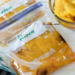Freezer bags filled with mashed pumpkin and labelled pumpkin, 2 cups.