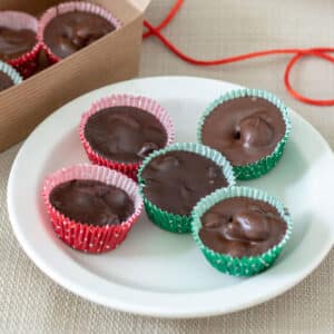chocolate covered peanuts on white plate