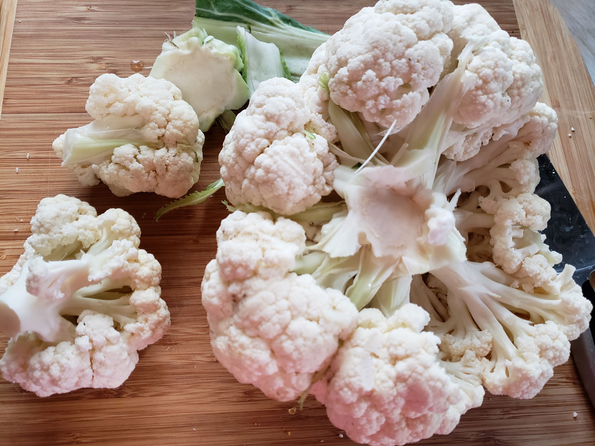 The core cut out of the middle of the cauliflower.