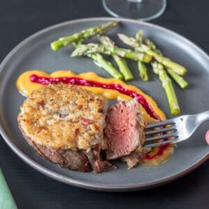 horseradish crusted beef filet on gray plate