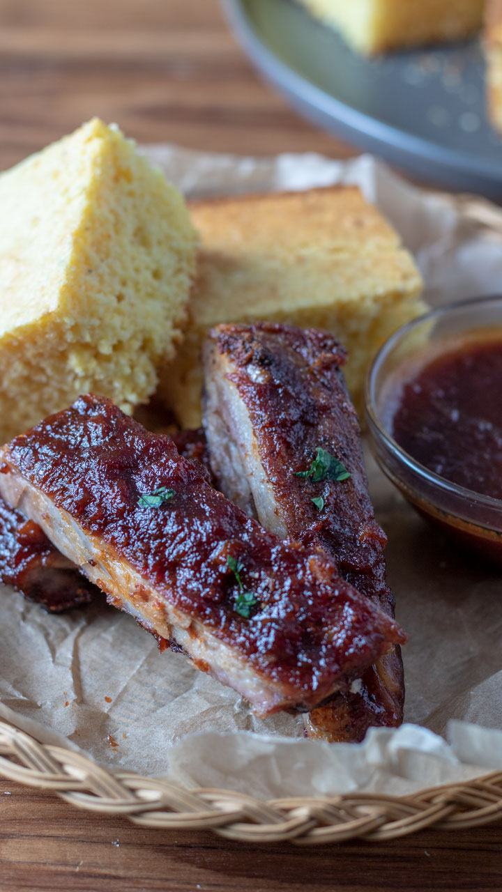 Smoked Spare Ribs on wicker basket close up..