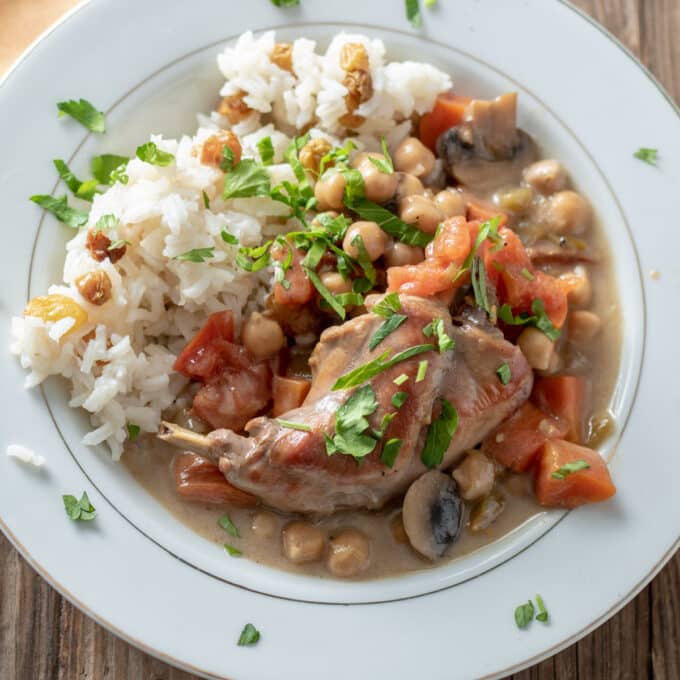 rabbit coconut stew in white bowl.