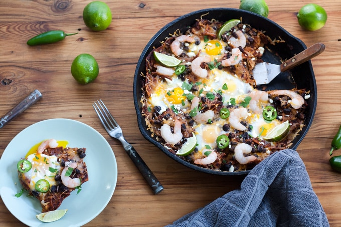 single serving baked chilaquiles with broken egg yolk