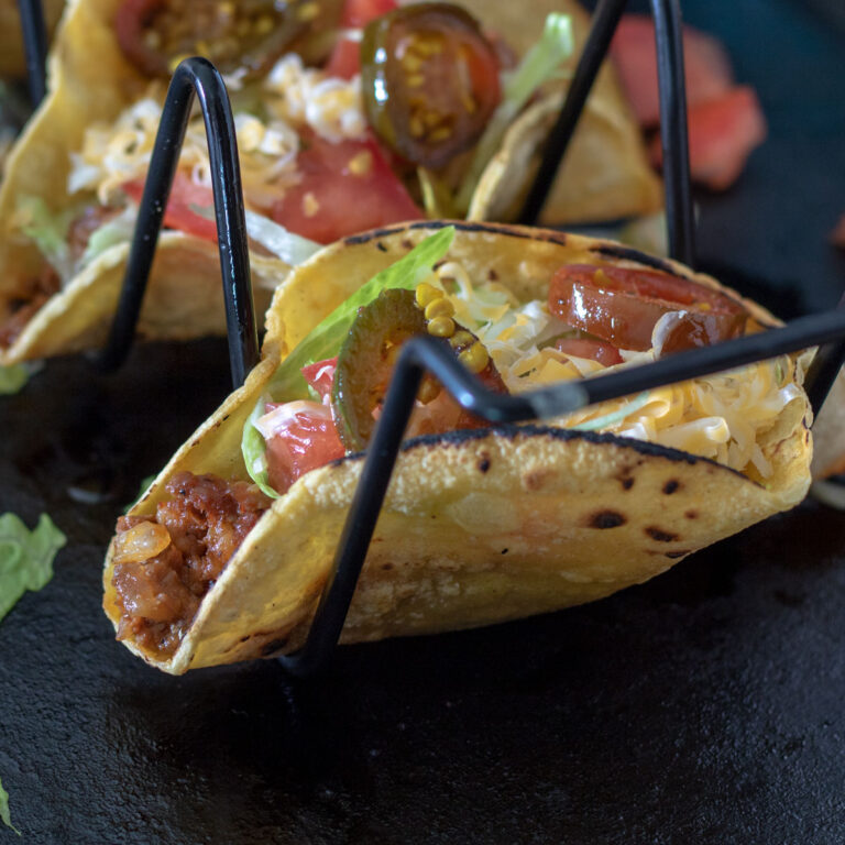 Chorio tacos in a stand.