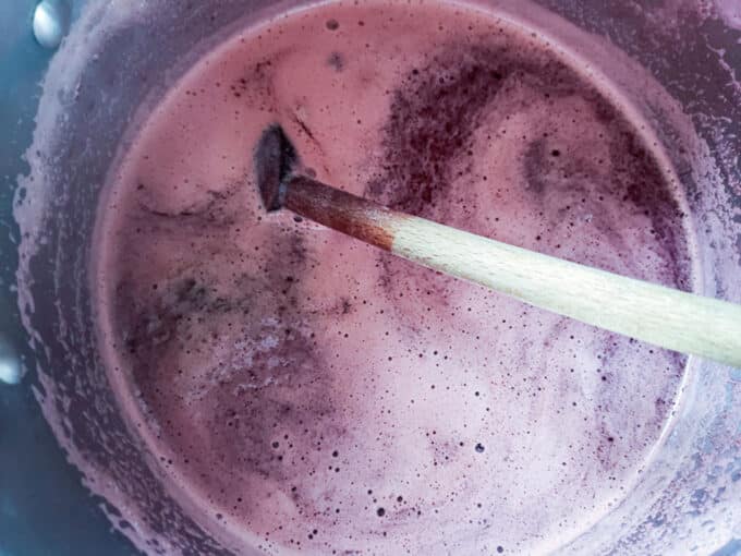 Adding sugar to pot.