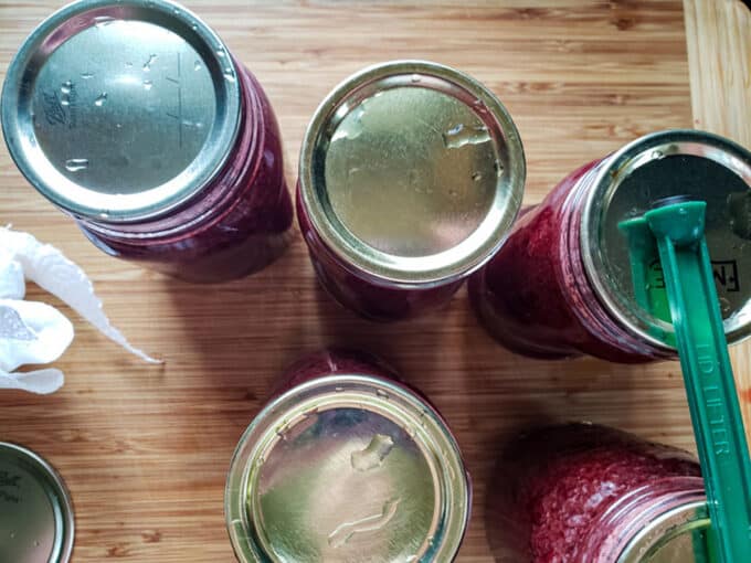 Lids placed on jars.
