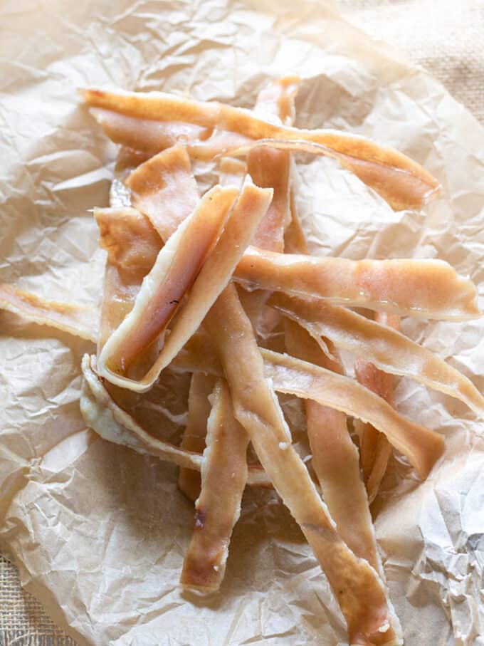 Dog chews made with pork skin. on paper bag.