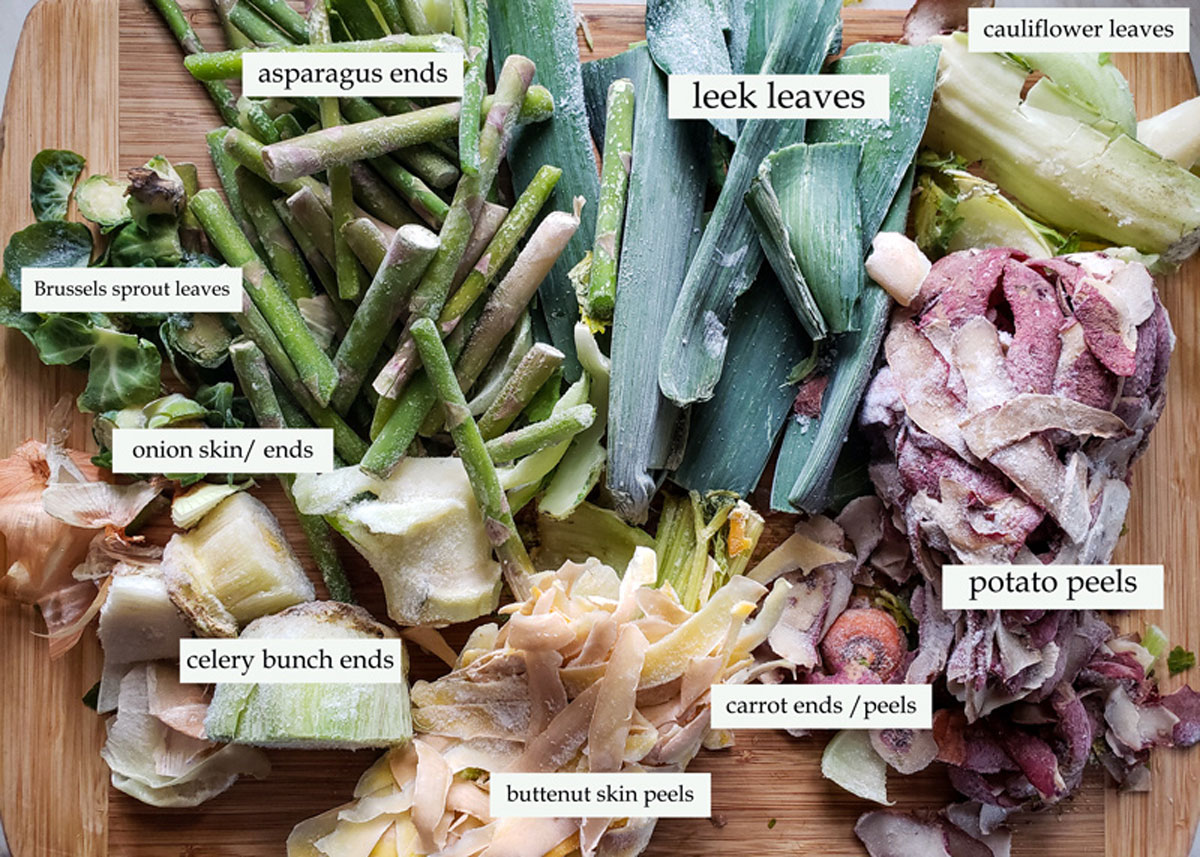 Illustration with various vegetable scraps used in stock.